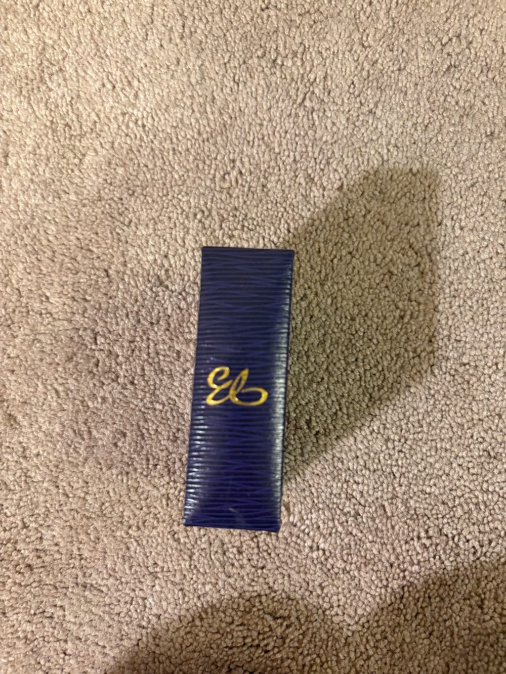 Navy Blue Textured Box with Gold Script Logo